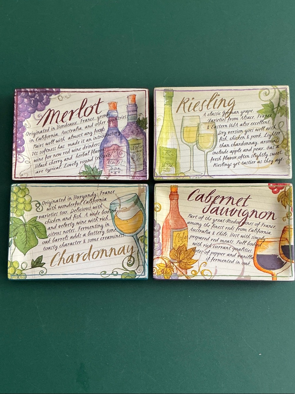 Four Grasslands Road wine-themed appetizer plates, vintage-style wine labels